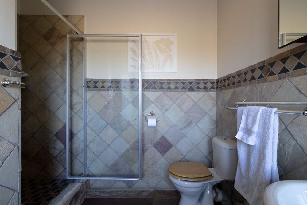 Full en-suite bathroom with close-up of shower area