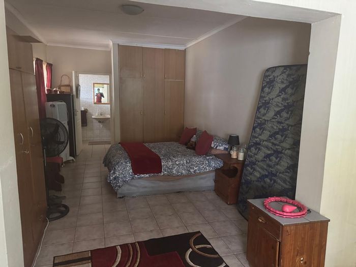 Spacious house with flats, garages, and multiple entrances in Windhoek Central For Sale.