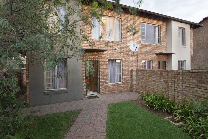 3-bedroom townhouse with private garden, double garage, 24h security in Tyger Valley. To Rent.