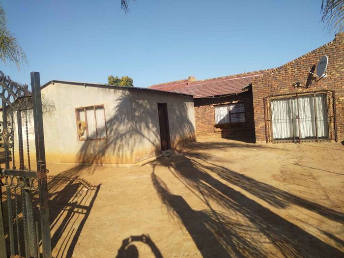 For Sale: House in Soshanguve South with dual living spaces and spacious yard.