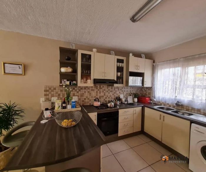For Sale: Townhouse in Windhoek Central with 2 beds, outdoor space, and parking.