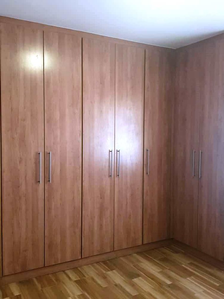 Cupboards in the spacious main bedroom