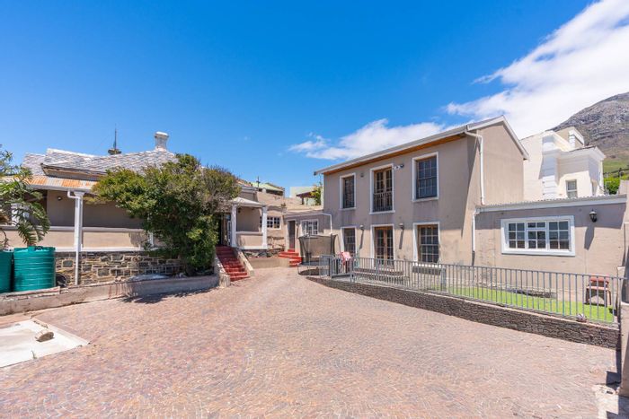 For Sale: Spacious 8-bedroom house in Walmer Estate with multiple cottages and parking.