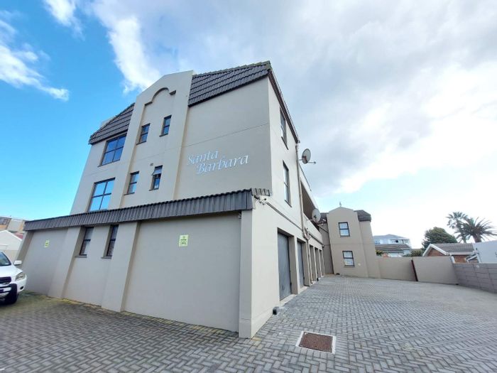 Top-floor 1-bedroom apartment in Table View, to rent with built-in braai and parking.