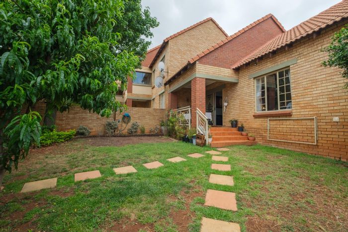 For Sale: Mooikloof Ridge Townhouse with garden, double garage, and estate amenities.