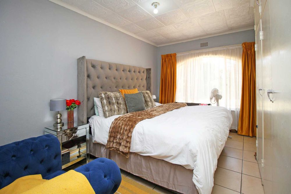 Bedroom 4 : King Size Bedroom with Built-In Cupboards and Floor Tiles