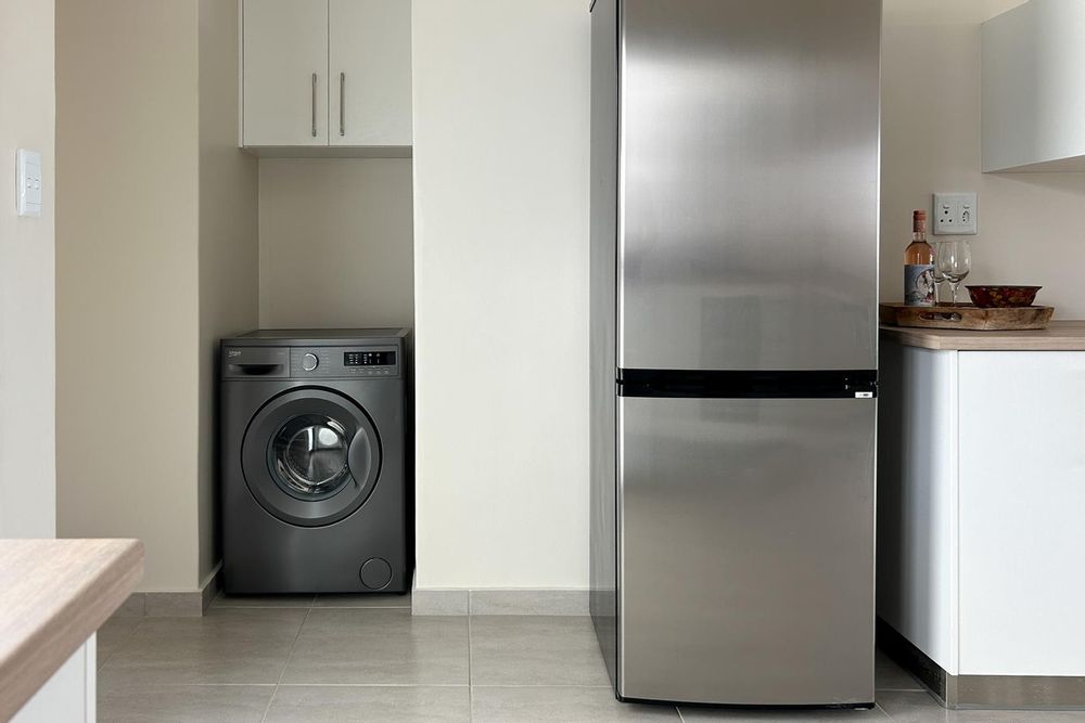 Kitchen with plenty of built-in cupboards and a built-in oven.