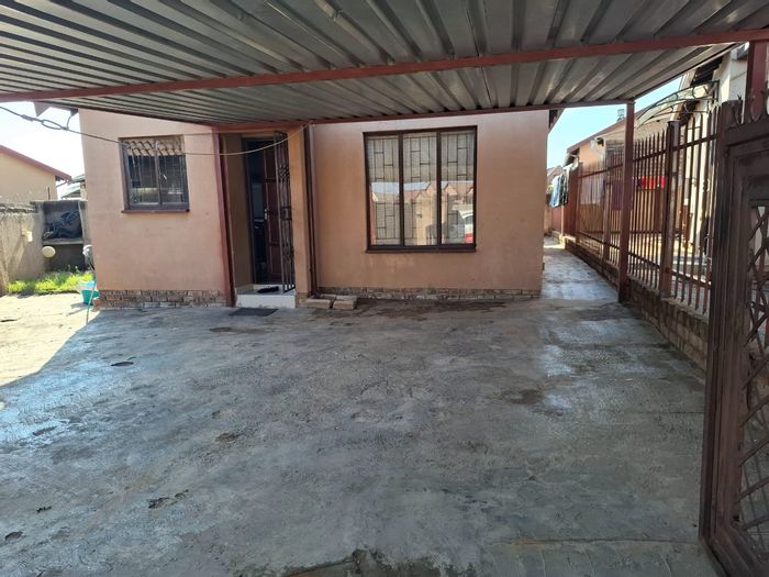 For Sale: House in Soshanguve Ext with 2 bedrooms, open living areas, and kitchen.