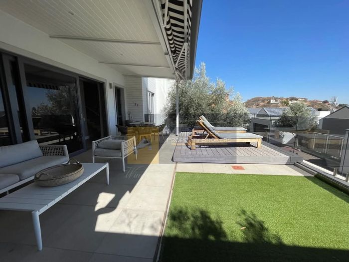 To Rent: Klein Windhoek Townhouse with pool, security, and nearby dining options.