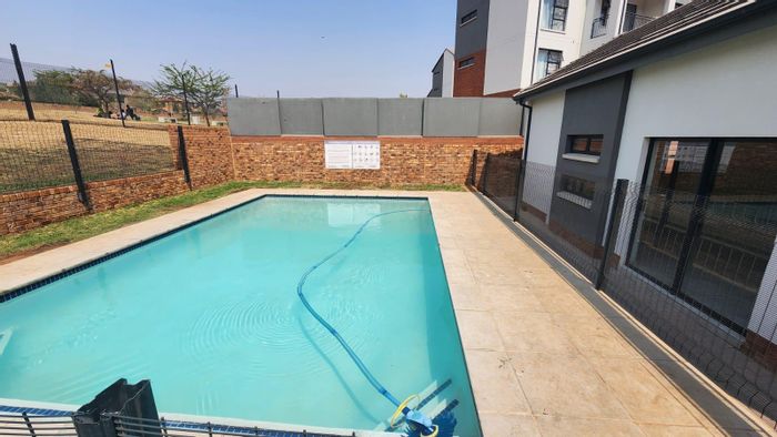 For Sale: Apartment in Amberfield Glen with clubhouse, pool, and 24-hour security.