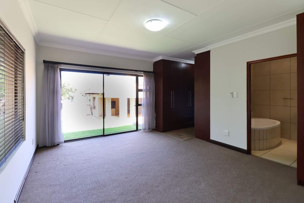 Main bedroom with sliding door to garden