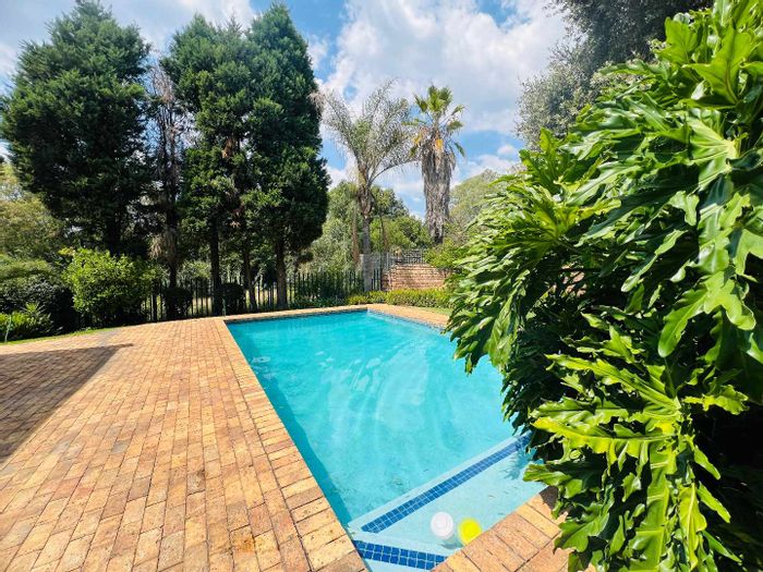 Charming bachelor apartment in Bryanston with upgraded bathroom and private garden, for sale.