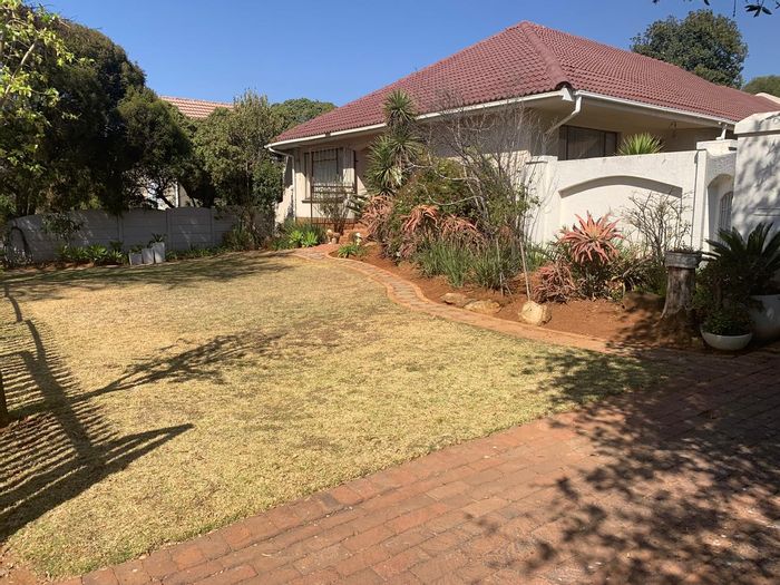 For Sale: House in Van Riebeeck Park with spacious living, security features, and landscaped garden.