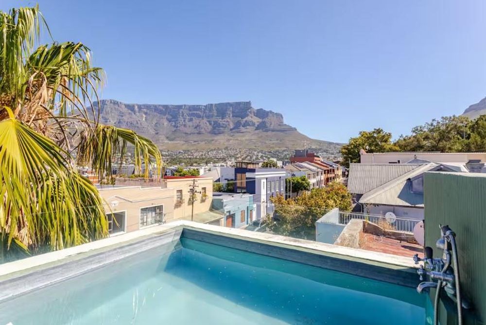 Private rooftop pool with panoramic Table Mountain, Lions Head and Devils Peak views