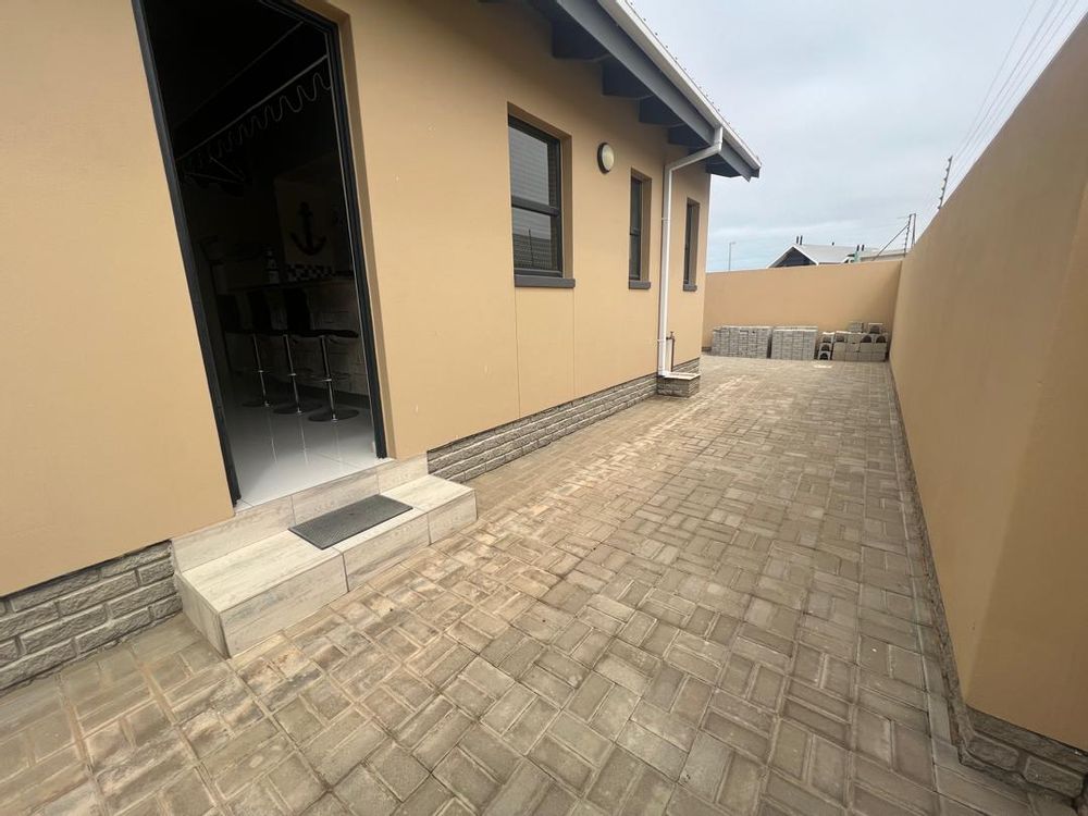 Back door by the lady's bar leading out to the BBQ