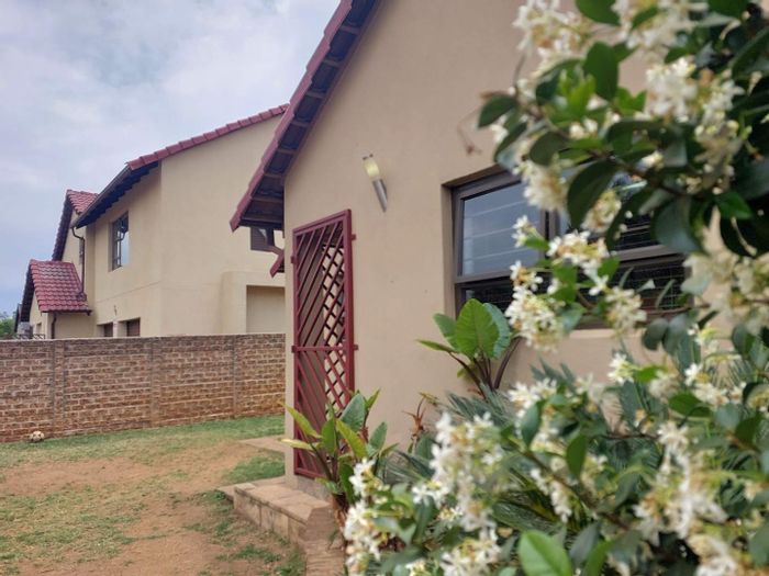 Townhouse For Sale in Boksburg North with pool, garden, and security features.