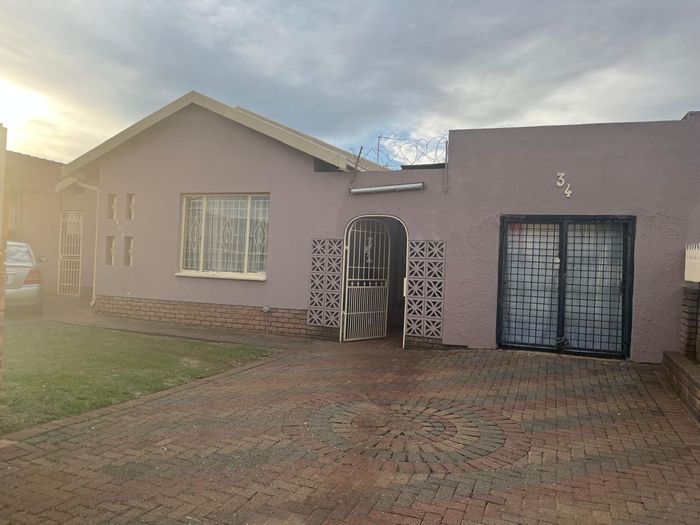 Versatile house for sale in Lenasia South Ext 1 with cottage and spacious yard.