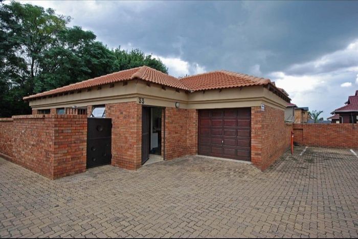 For Sale: Townhouse in New Market Park with security, garden, and garage.