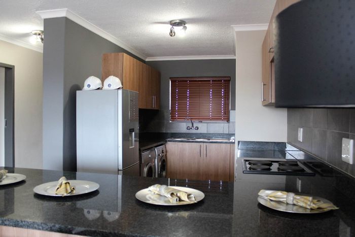 Highveld Apartment To Rent: 2 beds, secure access, pool, gym, and gardens.