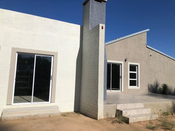 For Sale: House in Okahandja Central with 3 bedrooms, double garage, potential expansion.