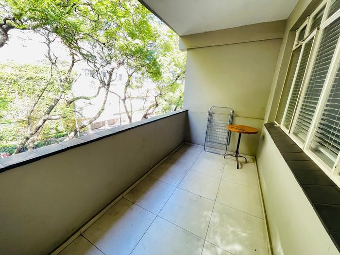 1 Bedroom Apartment To Rent in Rosebank, near Mall, with outdoor patio and amenities.