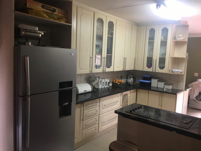 For Sale: Rooihuiskraal House with 3 bedrooms, double garage, and spacious garden.