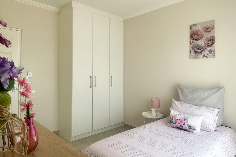 Third bedroom with built-in cupboards.