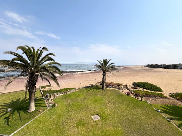 Beachfront Townhouse For Sale in Long Beach: Rooftop BBQ, garden, and double garage.