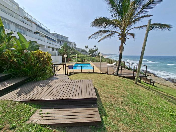 Beachfront apartment in Shakas Rock with sea-facing balcony and direct beach access. To Rent.