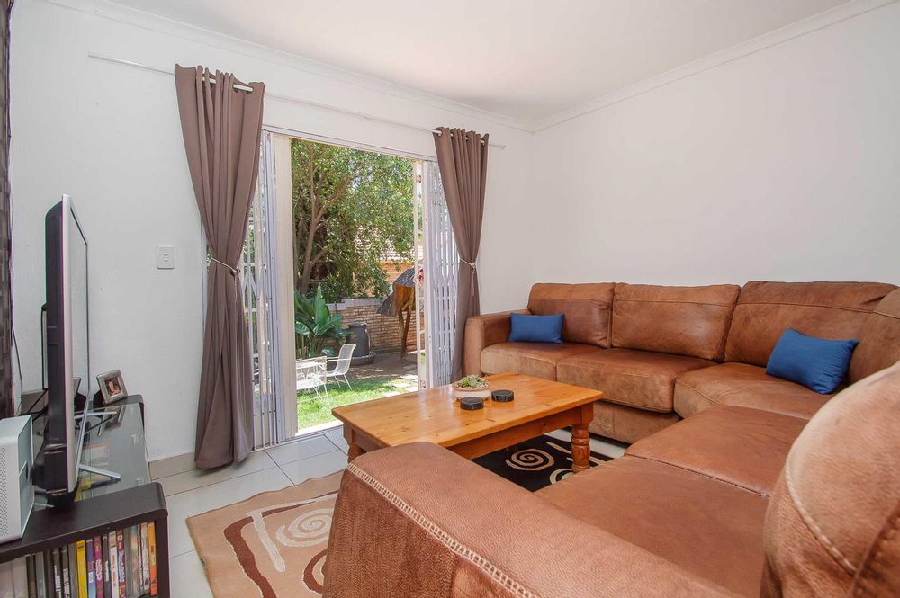 Lounge with French pane doors out to garden  