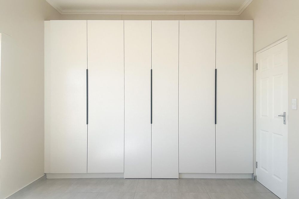 Main bedroom - cupboards with walk-in ensuite bathroom.