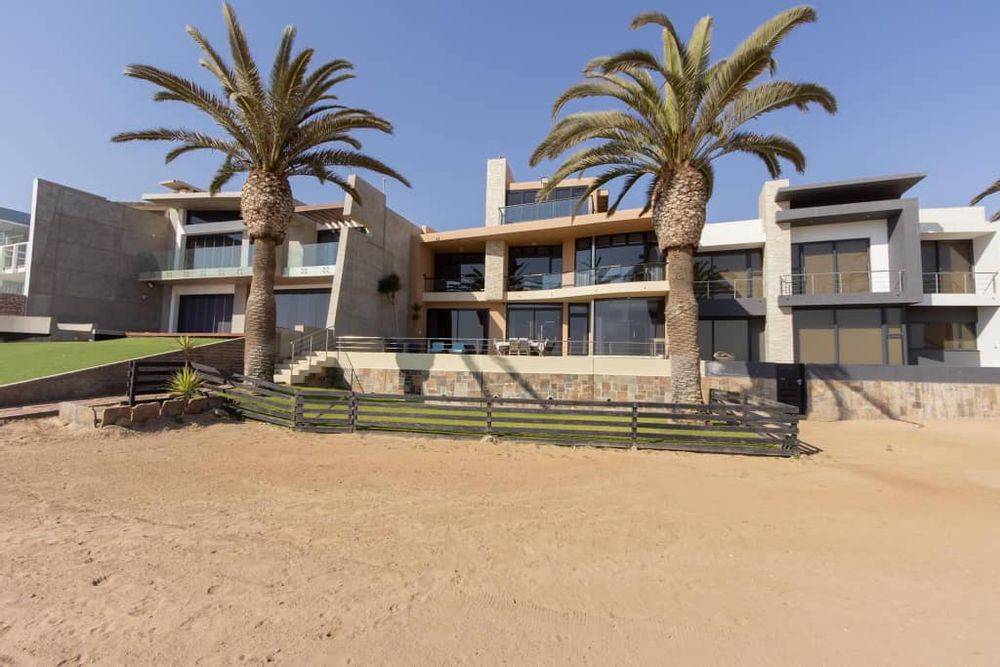 Step into a world of sophisticated living with this exquisite beachfront residence.