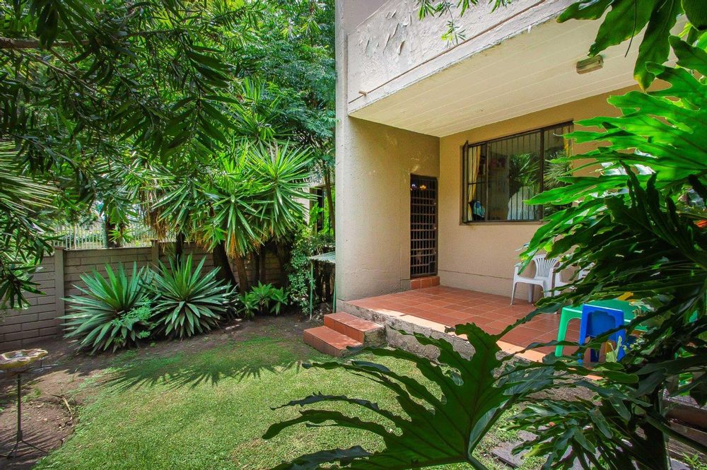 Private garden showing patio and lawn