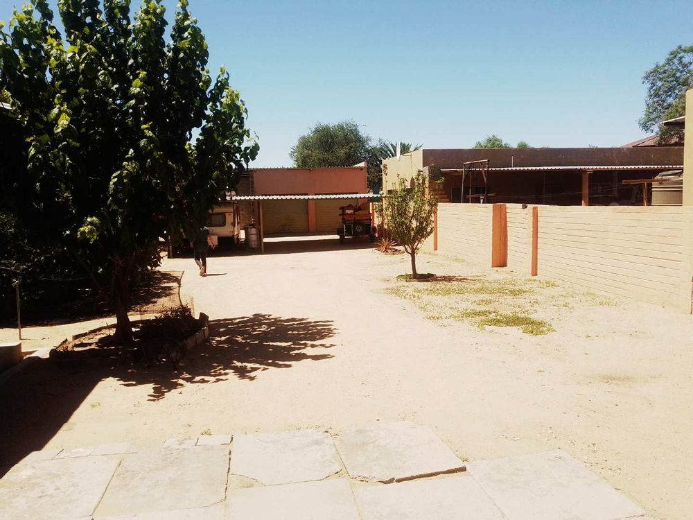 General view towards the double garage and under-cover parking area to the back of the property. 