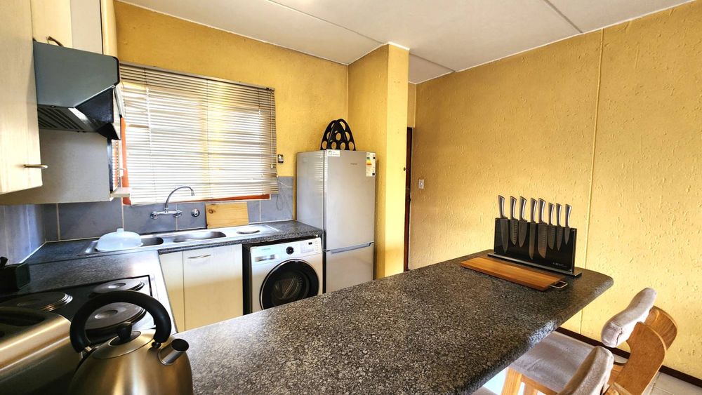 Spacious breakfast nook and food prep counter.
View to the front door.