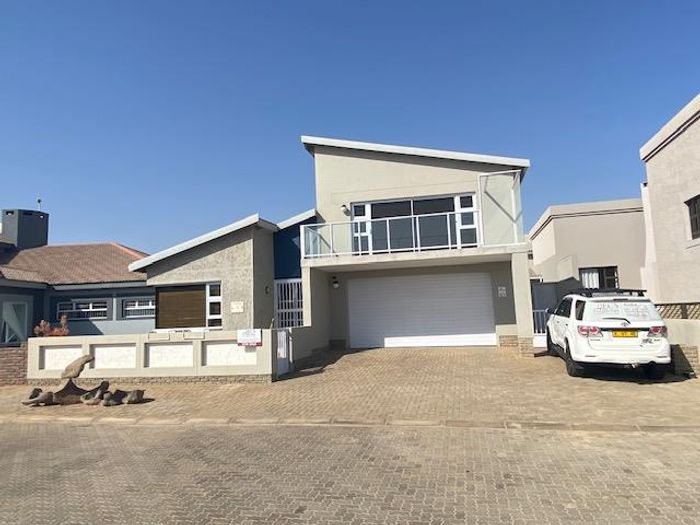 For Sale: House in Henties Bay Central with beach access, bar, and en-suites.