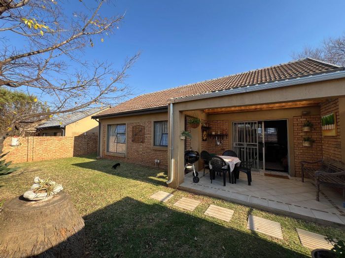 Spacious Equestria Townhouse for Sale: Modern Kitchen, Double Garage, Private Garden