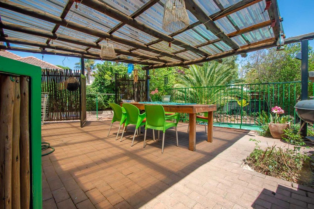 Covered patio overlooks pool