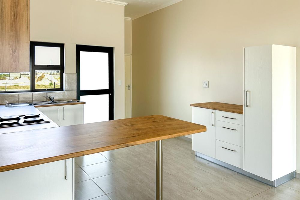 Kitchen with plenty of built-in cupboards and a built-in oven.