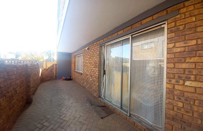 Ground floor apartment for sale in Kempton Park Central with private garden and laundry.