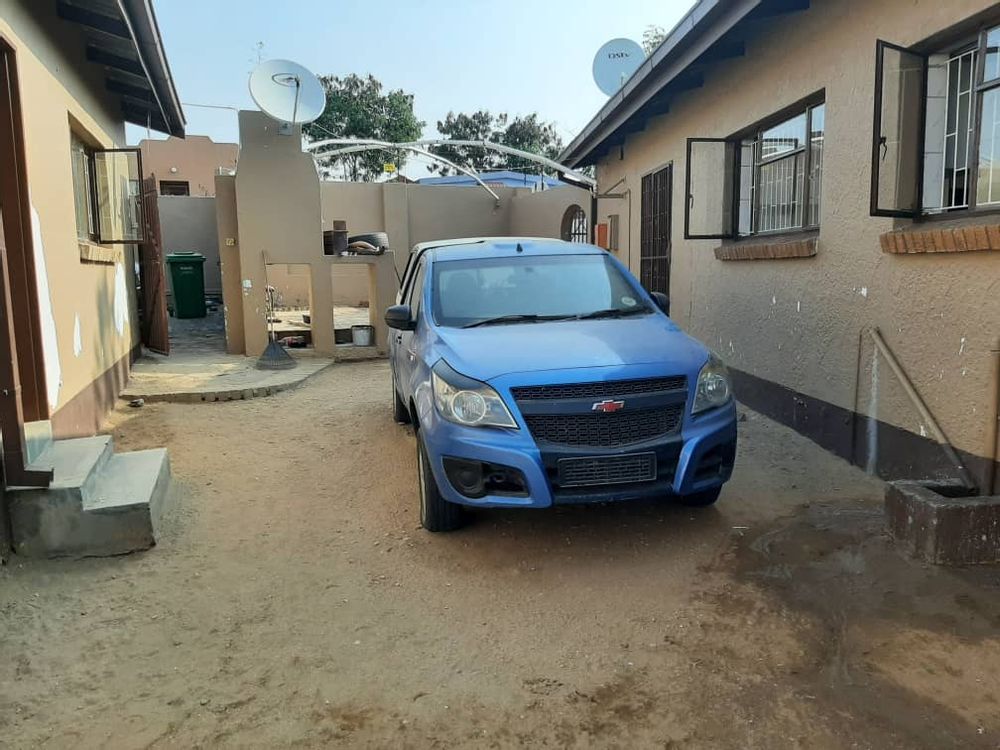 BBQ are view, on the right is the main house and left is the garages and the flat.