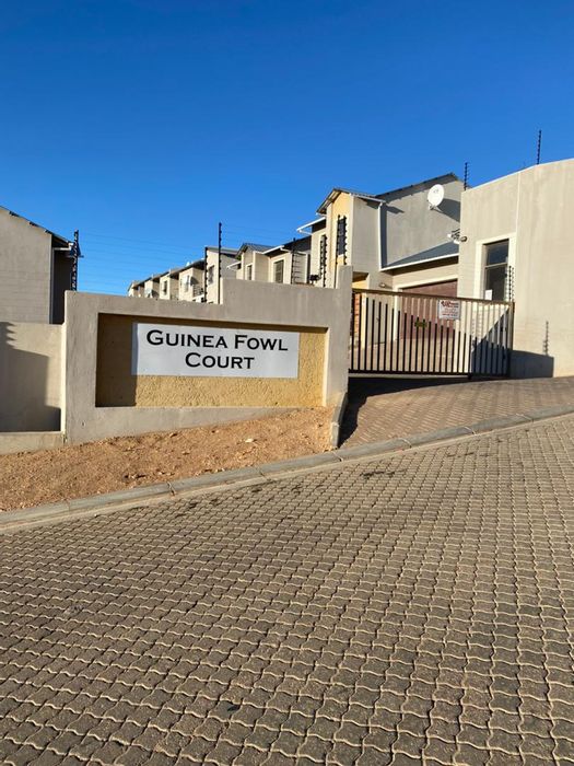 For Sale: Rocky Crest Townhouse with courtyard, double garage, and guest loo.