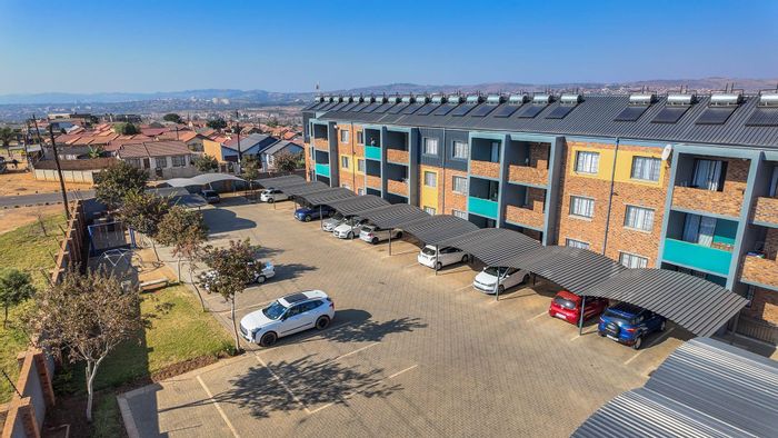 For Sale: Apartment in Lotus Gardens with 2 bedrooms, private patio, and parking.