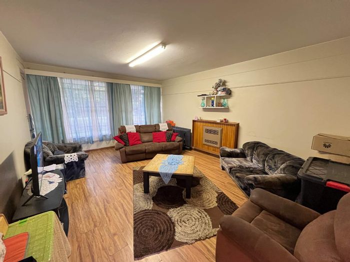 Ground-floor apartment in Greenhills for sale, features garage and communal garden access.