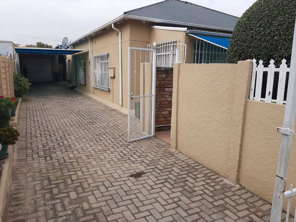 Front entrance with garage and carport