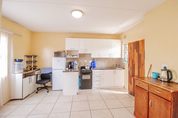 For Sale: 2-bedroom apartment in Roodepoort Central with 24-hour security and communal amenities.