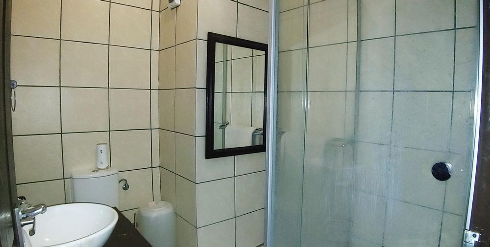 Fully tiled bathroom with shower 