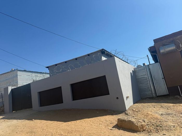 House for Sale in Katutura: 2 Bedrooms, well-appointed kitchen, and modern bathroom.