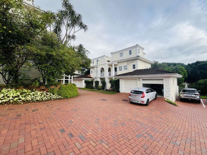 La Lucia Townhouse For Sale: Secure estate living with pool, garage, and community amenities.
