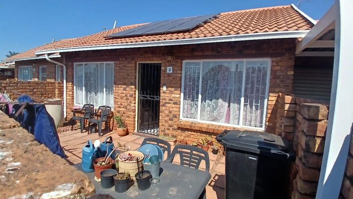 Townhouse For Sale in Norkem Park: 2 beds, garage conversion, playground access.